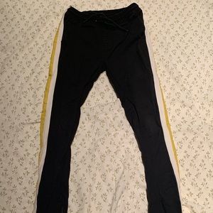 Black skinny jeans with yellow and white stripes